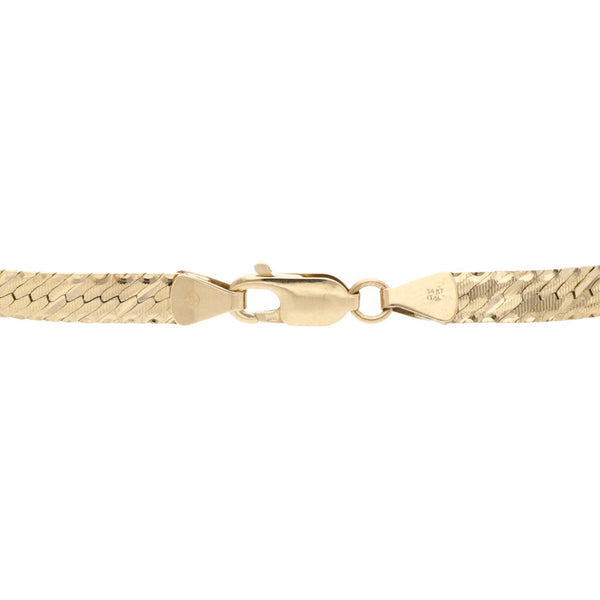 Pulsera eslabón planchado en oro amarillo 14 kilates.