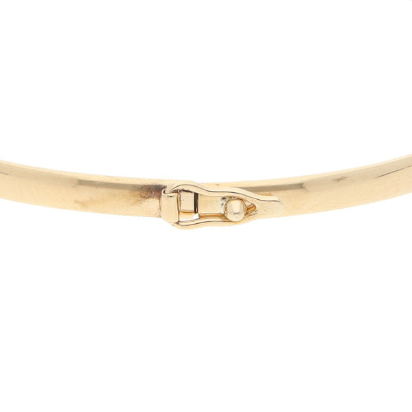 Pulsera de arillo hueca en oro amarillo 14 kilates.