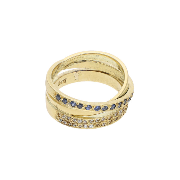 Anillo diseño especial con sintéticos en oro amarillo 12 kilates.