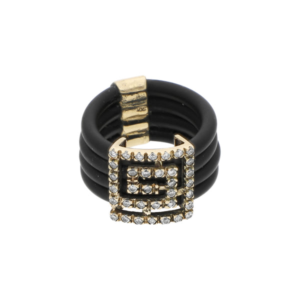 Anillo de caucho con aplicaciones motivo greca y circonias en oro amarillo 14 kilates.
