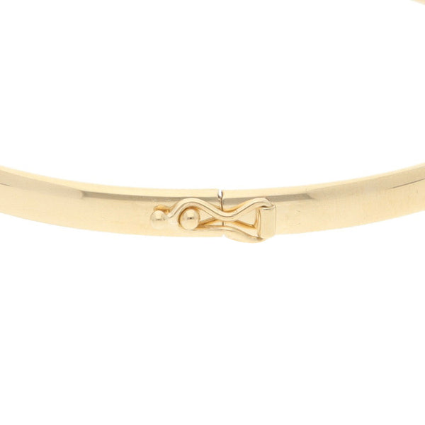 Pulsera de arillo articulada con aplicaciones y sintéticos en oro amarillo 14 kilates.