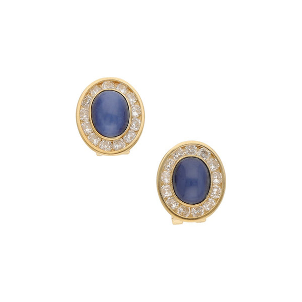 Aretes diseño especial con zafiros estrella y circonias en oro amarillo 14 kilates.