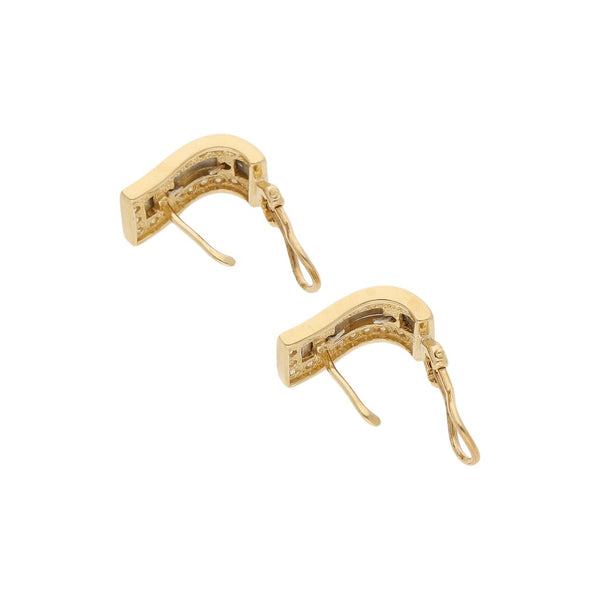 Juego de anillo y aretes diseño especial con circonias en oro dos tonos 14 kilates.