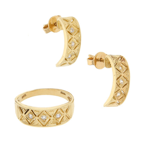 Juego de anillo y broqueles calados con circonias en oro amarillo 14 kilates.