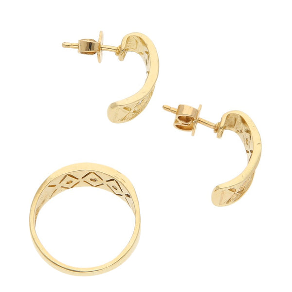 Juego de anillo y broqueles calados con circonias en oro amarillo 14 kilates.