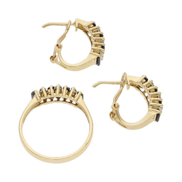 Juego de Anillo y aretes diseño especial con sintéticos en oro amarillo 14 kilates.