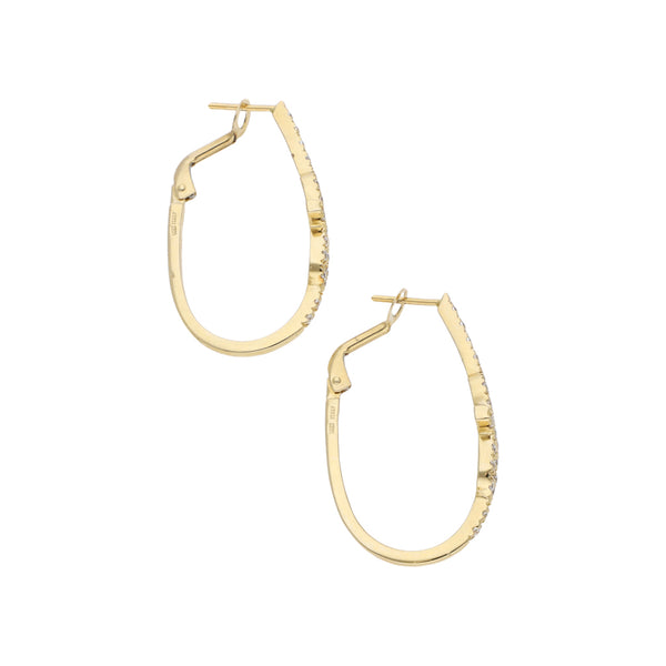 Arracadas diseño especial con circonias en oro amarillo 14 kilates.