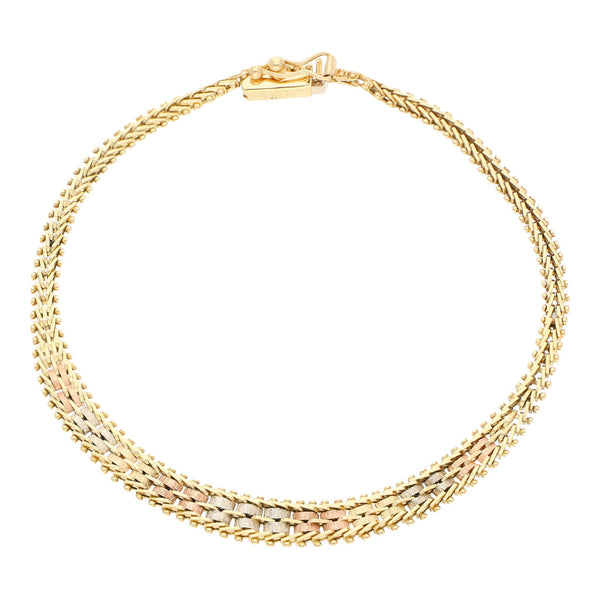 Pulsera eslabón boleado en oro tres tonos 14 kilates.