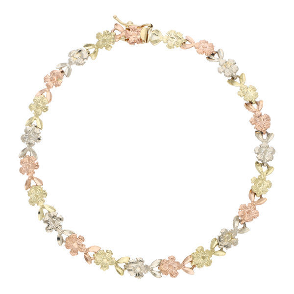 Pulsera eslabón articulado motivo flores en oro tres tonos 14 kilates.