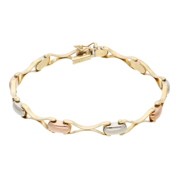Pulsera eslabón articulado en oro tres tonos 14 kilates.