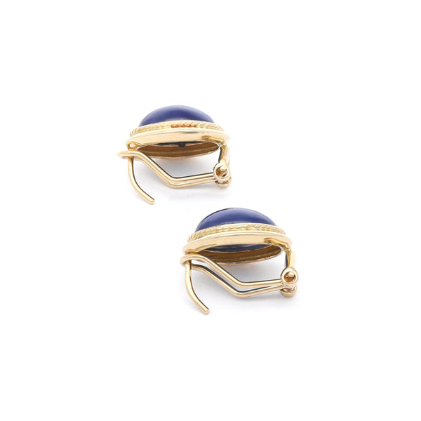 Aretes diseño especial con zafiro estrella en oro amarillo 14 kilates.