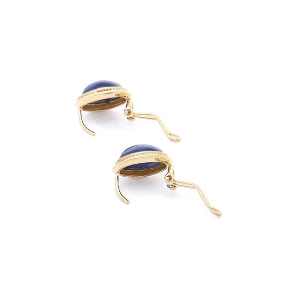 Aretes diseño especial con zafiro estrella en oro amarillo 14 kilates.