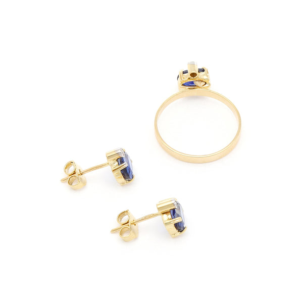 Juego de anillo y aretes diseño especial con zafiros y circonias en oro amarillo 14 kilates.