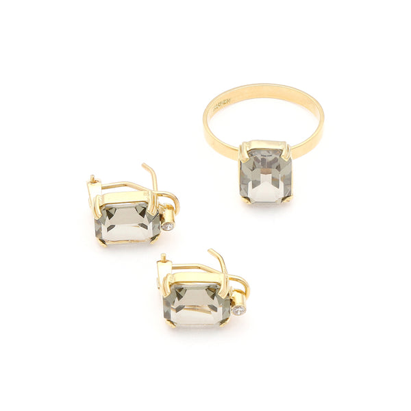 Juego de anillo y aretes diseño especial con topacios y circonias en oro amarillo 14 kilates.