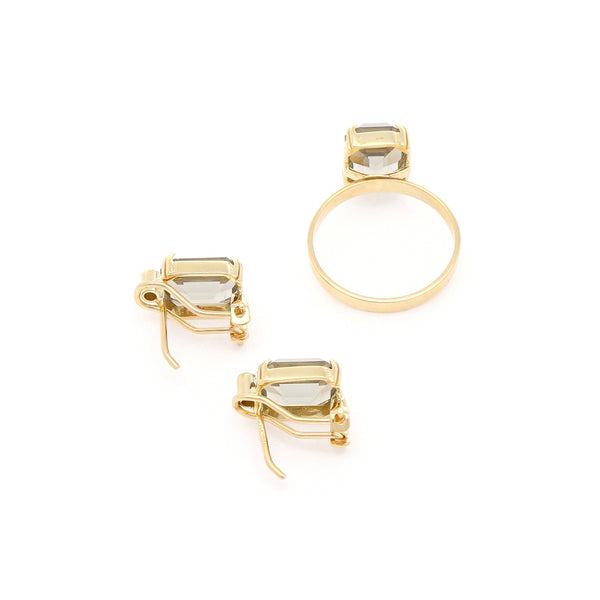Juego de anillo y aretes diseño especial con topacios y circonias en oro amarillo 14 kilates.