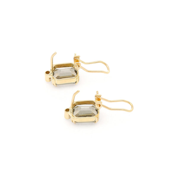 Juego de anillo y aretes diseño especial con topacios y circonias en oro amarillo 14 kilates.