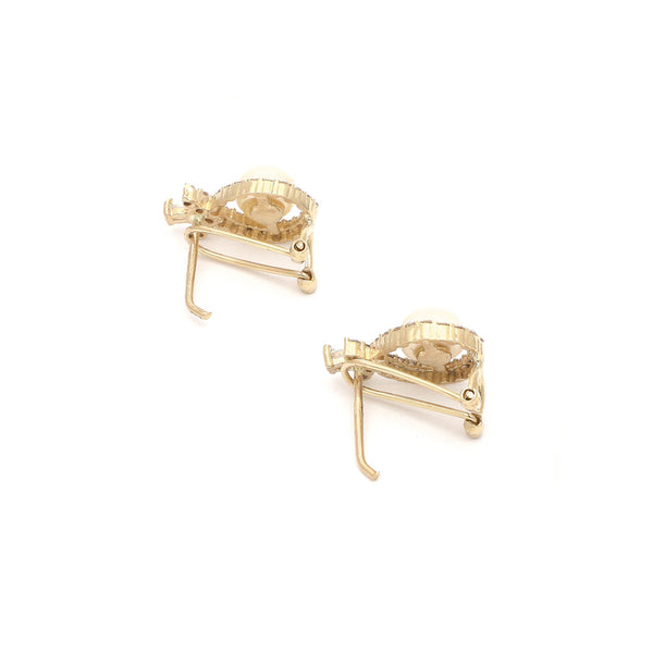 Aretes diseño especial con perla y circonias en oro amarillo 14 kilates.
