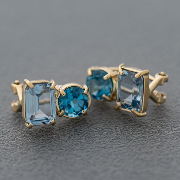 Aretes diseño especial con aguamarinas y topacios en oro amarillo 14 kilates.