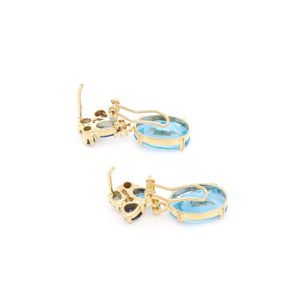 Juego anillo y aretes con colgantes diseño especial con diamantes y topacios en oro amarillo 14 kilates.