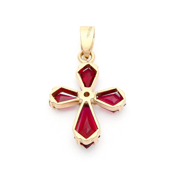 Cruz diseño especial con rubíes y circonia en oro amarillo 14 kilates.