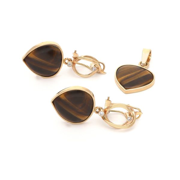 Juego de dije y aretes diseño especial con ojo de tigre y circonias en oro amarillo 14 kilates.