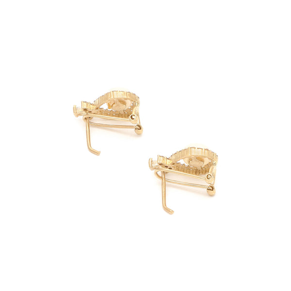 Aretes diseño especial con perla y circonias en oro amarillo 14 kilates.