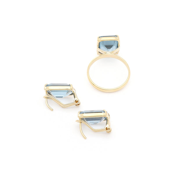 Juego anillo y aretes diseño especial con topacios en oro amarillo 14 kilates.