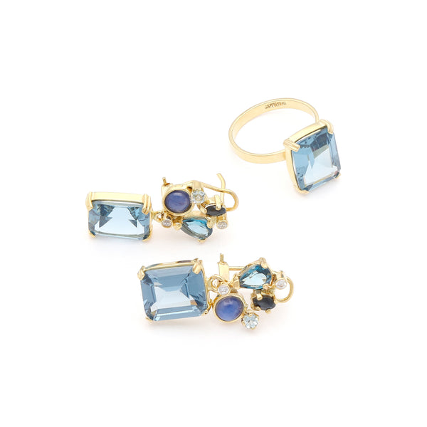 Juego de anillo y aretes diseño especial con zafiros y gemas en oro amarillo 14 kilates.