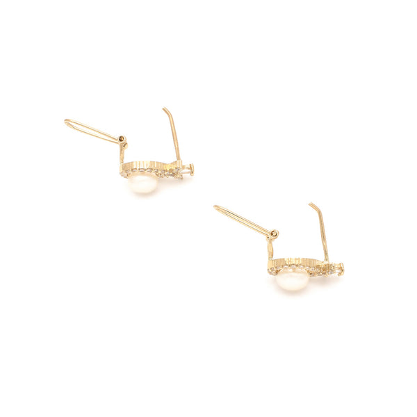 Aretes diseño especial con perla y circonias en oro amarillo 14 kilates.