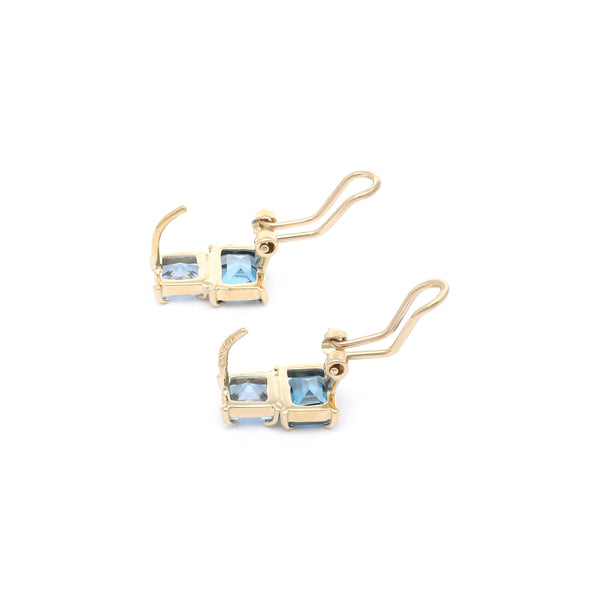 Aretes diseño especial con aguamarina y topacio en oro amarillo 14 kilates.
