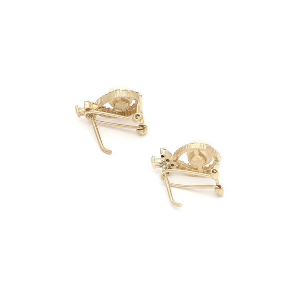 Aretes diseño especial con perlas y circonias en oro amarillo 14 kilates.