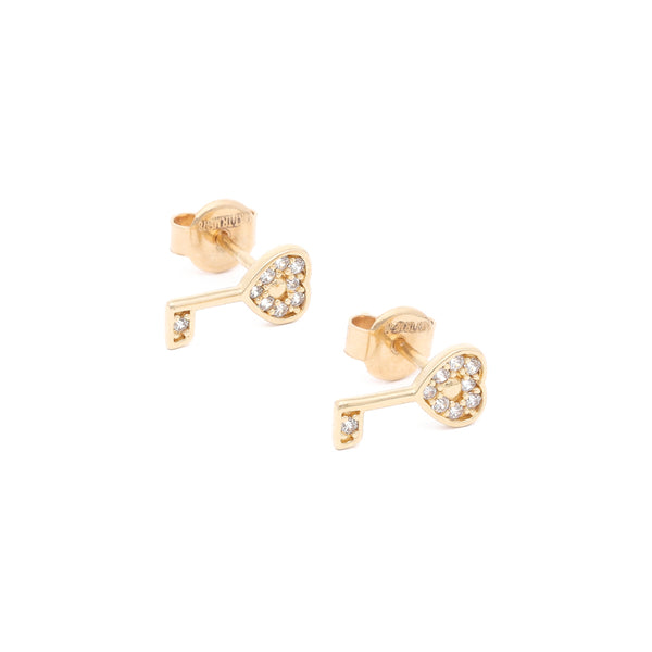 Aretes diseño especial con circonias motivo llave en oro amarillo 14 kilates.