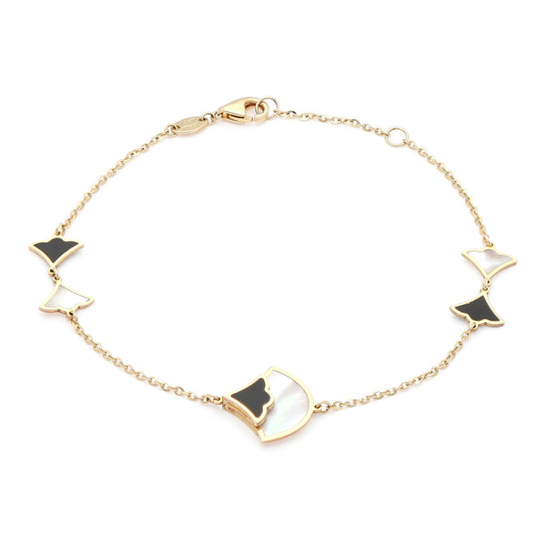 Pulsera eslabón cruzado con aplicaciones motivo abanico con sintéticos en oro amarillo 14 kilates.