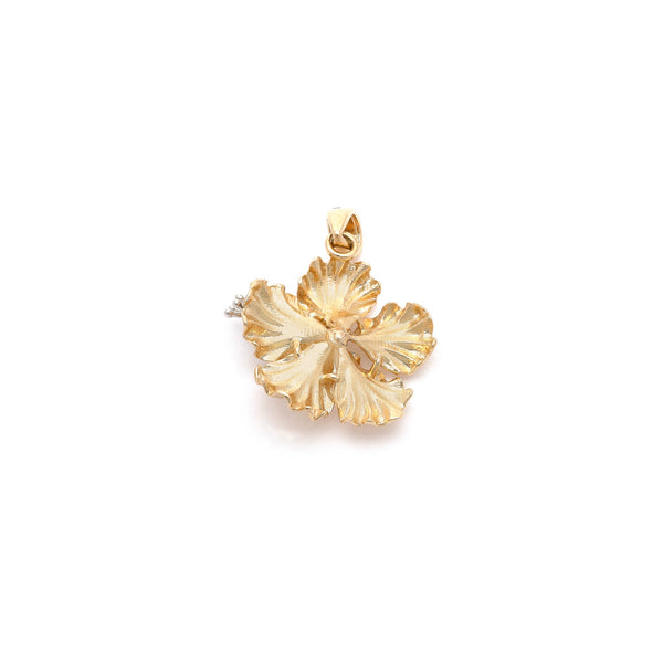 Dije diseño especial motivo flor en oro dos tonos 14 kilates.