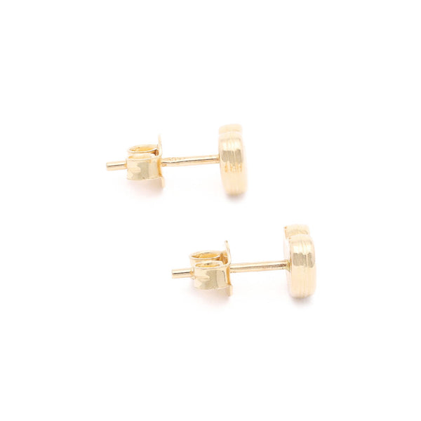 Aretes facetados en oro amarillo 14 kilates.