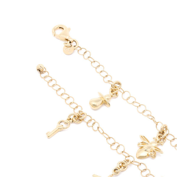 Pulsera eslabón cruzado con colgantes figuras diferentes en oro amarillo 14 kilates.