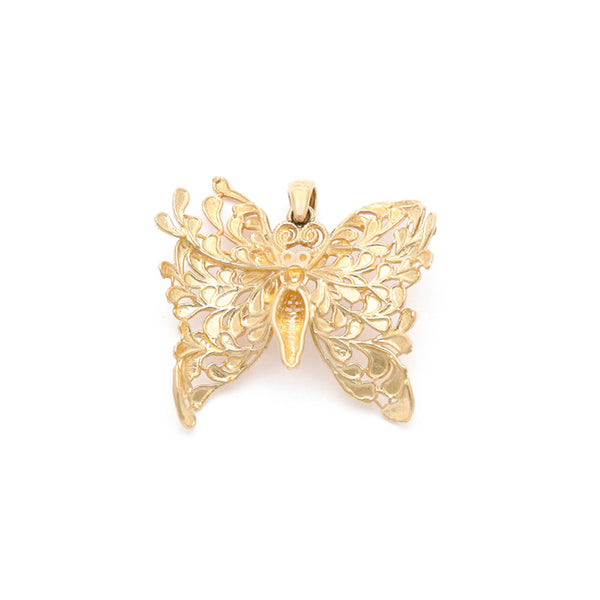 Dije calado motivo mariposa en oro amarillo 14 kilates.
