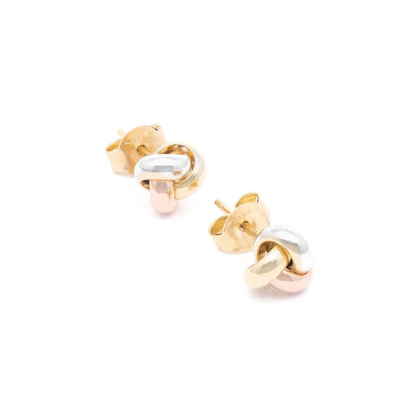 Aretes diseño especial motivo nudo en oro tres tonos 14 kilates.