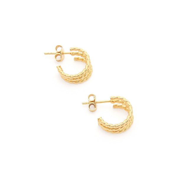 Aretes trenzados en oro amarillo 14 kilates.