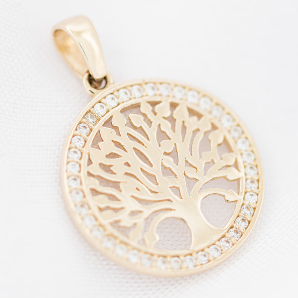 Dije calado motivo árbol con circonias en oro amarillo 14 kilates.