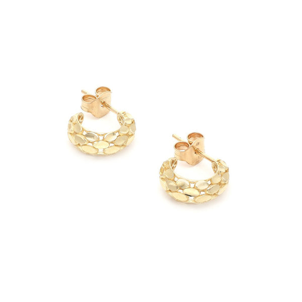 Aretes barrocos en oro amarillo 14 kilates.