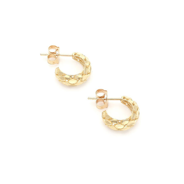 Aretes barrocos en oro amarillo 14 kilates.