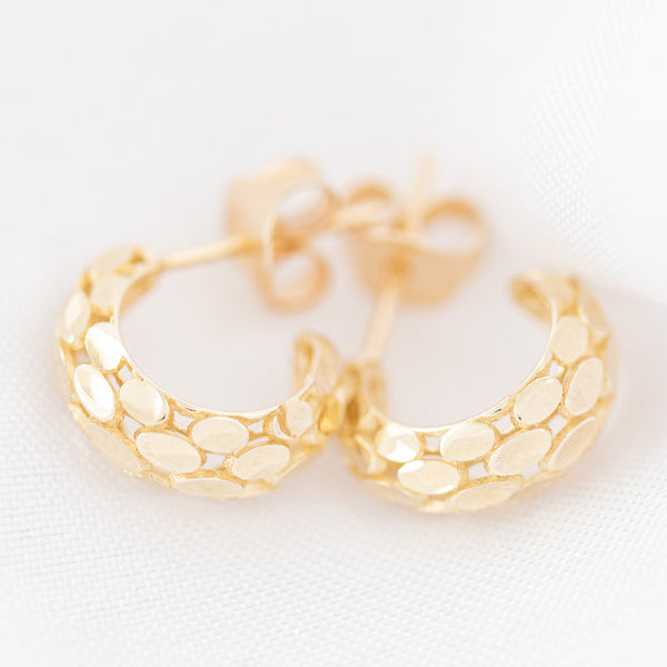 Aretes barrocos en oro amarillo 14 kilates.