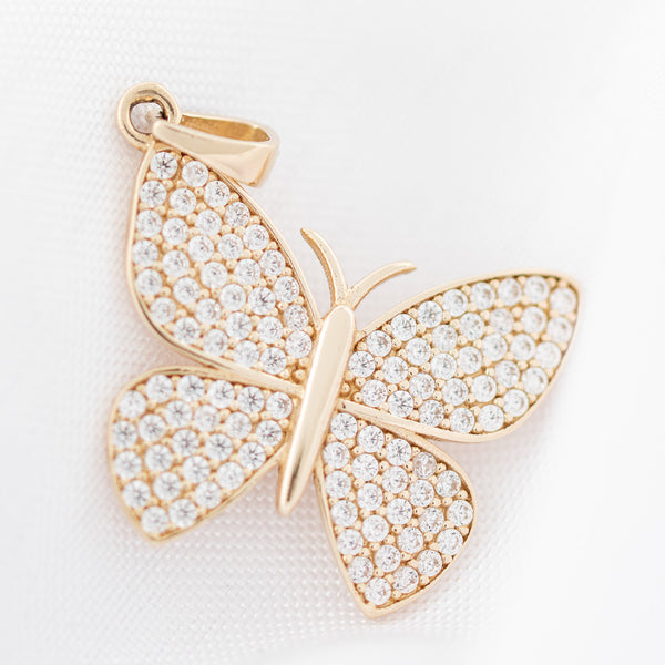 Dije diseño especial con circonias motivo mariposa en oro amarillo 14 kilates.
