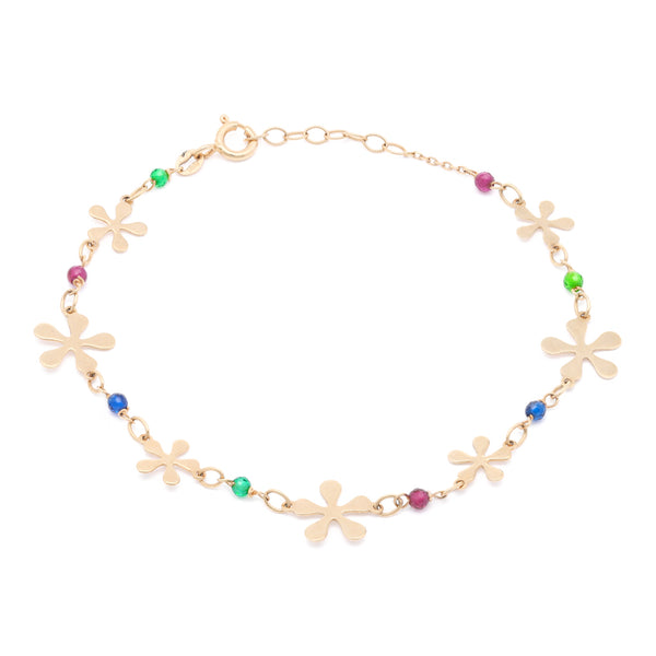 Pulsera eslabón cruzado con sintéticos y aplicaciones motivo flor en oro amarillo 14 kilates.