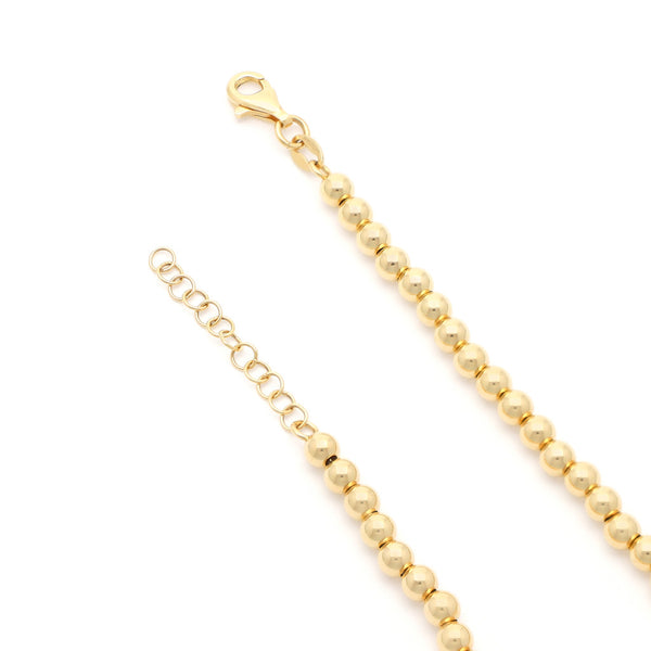Pulsera eslabón boleado en oro amarillo 14 kilates.