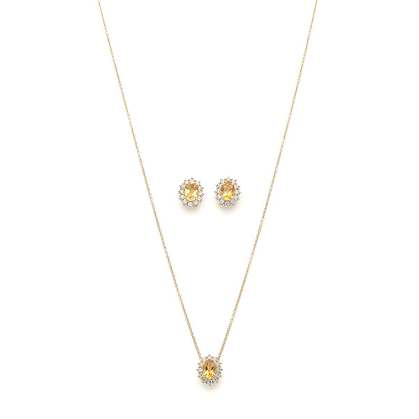 Juego de gargantilla eslabón cruzado con dije y aretes diseño especial con sintéticos en oro amarillo 14 kilates.