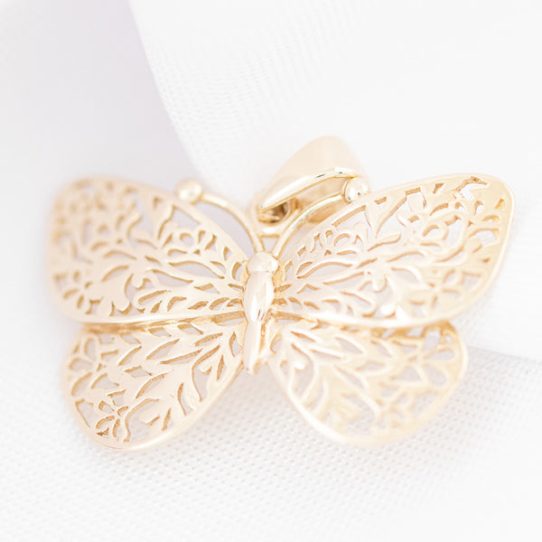 Dije calado motivo mariposa en oro amarillo 14 kilates.
