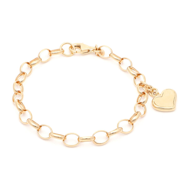 Pulsera eslabón cruzado con colgante motivo corazón en oro amarillo 14 kilates.