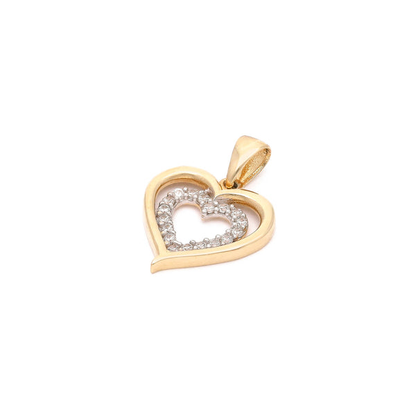 Dije diseño especial con circonias motivo corazón en oro amarillo 14 kilates.